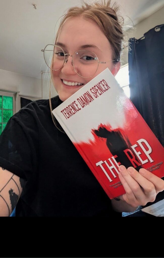 Emily after reading The REP by award winning Author Terrence Damon Spencer